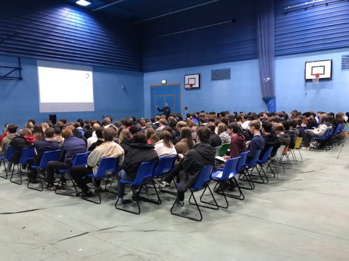 Hall of students listening to Caroline Cavanagh's talk on anxiety